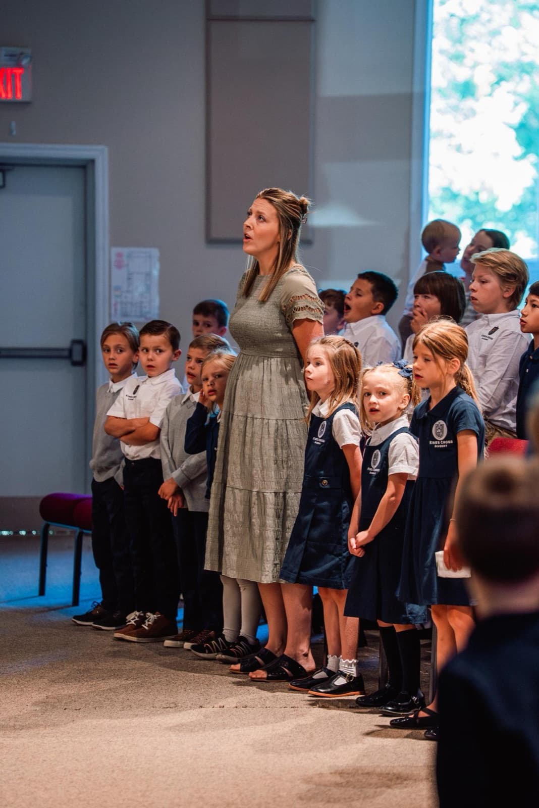 Students singing together at chapel
