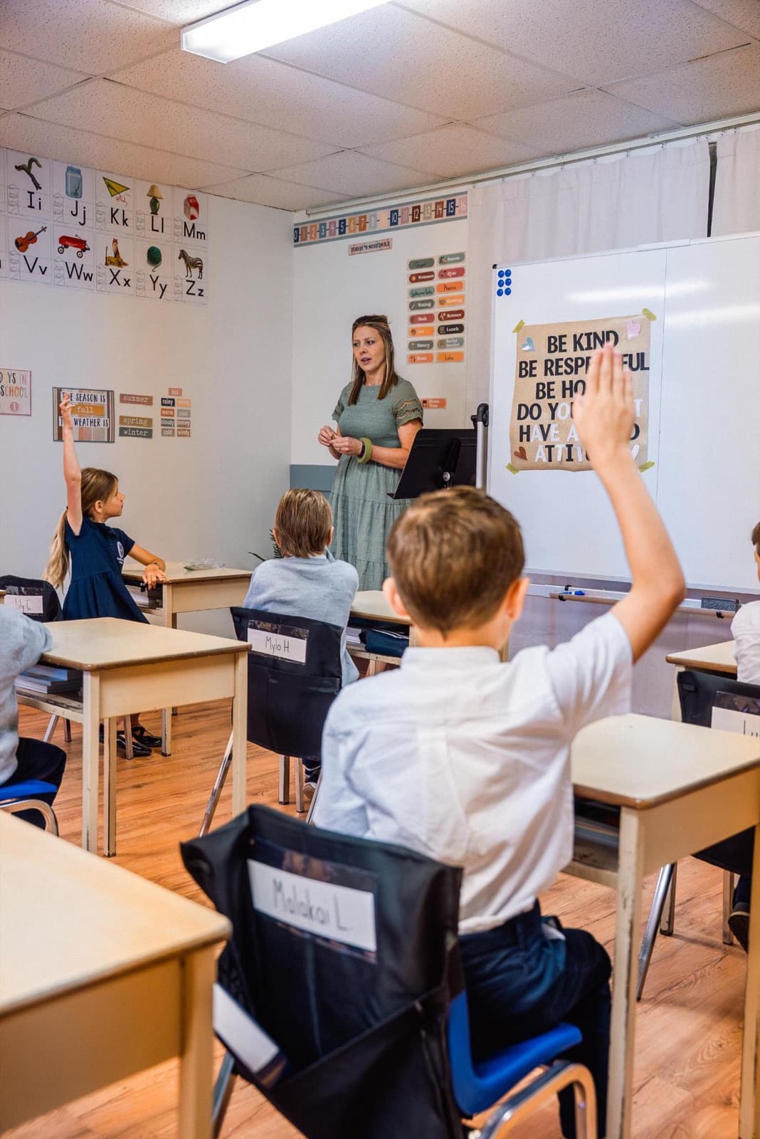 Hands raised during an elementary lesson